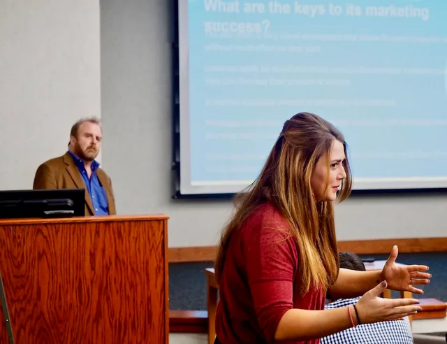 Rachel Adams (right) talks to her Marketing 100 class during presentations of a marketing plan case study for the Charlottesville (Va.)-based Hospice of the Piedmont at Germanna Community College on Tuesday, December 5, 2017. (At left, background, is Neil Mairs, Associate Professor of Business.) (Fr. What Separates the Strong Marketing Case Study Examples From the Weak
