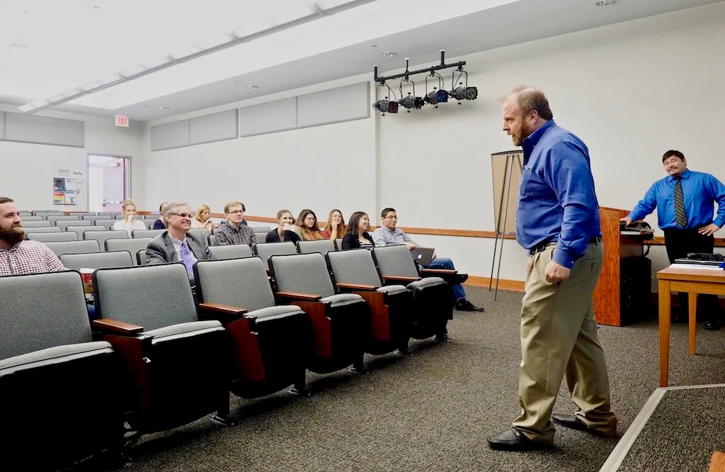 Germanna Community College's Marketing 100 instructor Neil Mairs (right, Associate Professor of Business) talks to his students and guests at his class' marketing plan case study presentations for the Charlottesville (Va.)-based Hospice of the Piedmont on Tuesday, December 5, 2017 at the Fredericksb. Marketing Case Study Sections in Plain Terms
