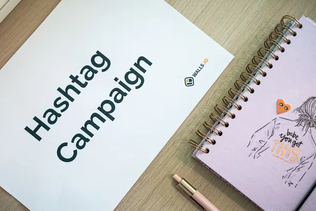 Creative desk setup featuring a hashtag campaign paper and a motivational notebook, ideal for marketing and planning themes. Marketing Proposal Templates: 2027 Business Guide
